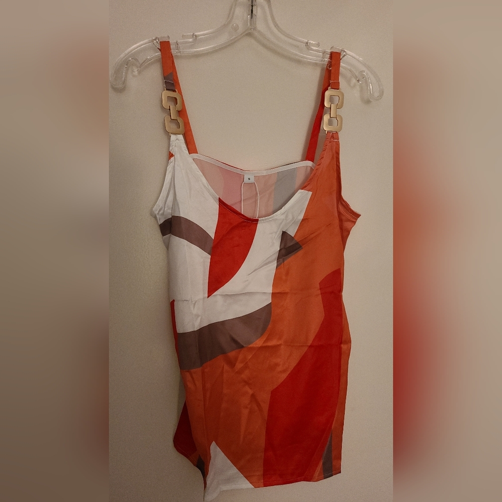 Sleeveless silk/poly tank top with metal decor.